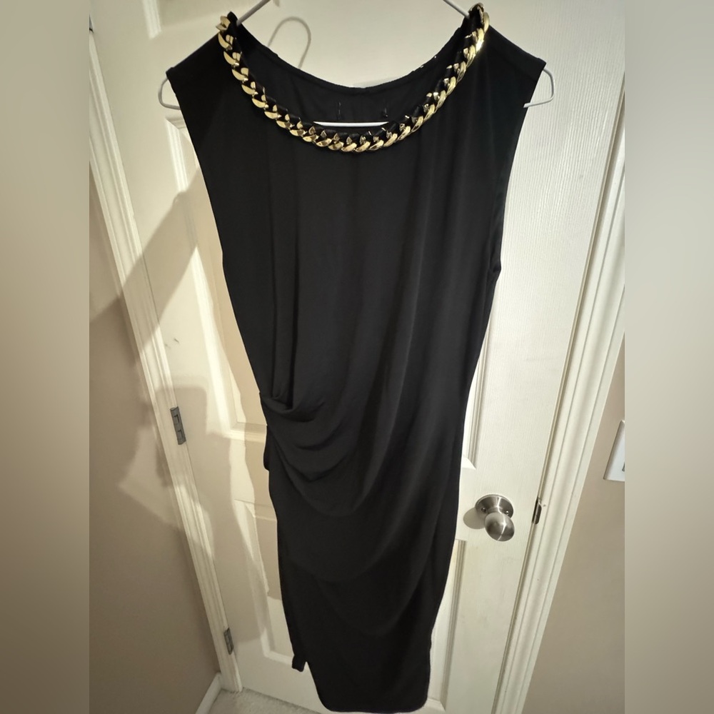Elegant Black Dress with Gold Chain Detail